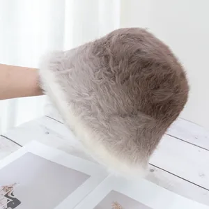 Close-up of soft faux rabbit fur bucket hat with grey gradient plush texture detail