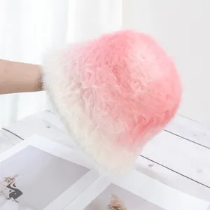 Close-up of pink and white gradient plush bucket hat with soft faux rabbit fur texture