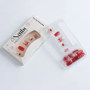 Detailed set of red heart cat-eye press-on nails in branded packaging box with tray