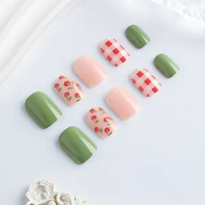 Short square press-on nails set featuring floral patterns and green pink color block