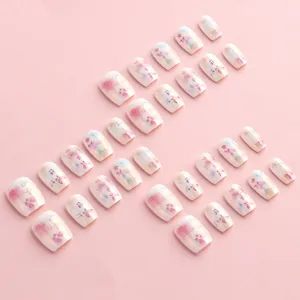 Floral press-on nails with iridescent pearl finish and sweet pink flower patterns