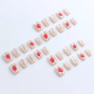 Short trapezoid glossy press-on nails with pink cat-eye strawberry and 3D water drops