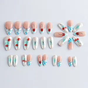 Glossy almond fake nails set featuring 3D cherry patterns and blue gradient finishes