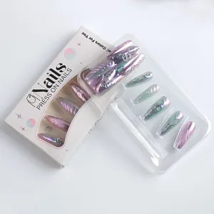 Macro detail of long pointed press-on nails with iridescent metallic relief textures