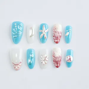 Almond ocean press-on nails with 3D starfish shell relief and wave patterns