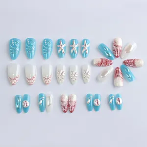 Almond ocean press-on nails with 3D starfish reliefs and blue shell patterns