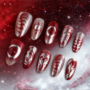 Starry dark red almond press-on nails with 3D gold heart and gothic celestial patterns