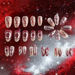 Detail of dark red galaxy press-on nails with 3D gold heart and star pattern
