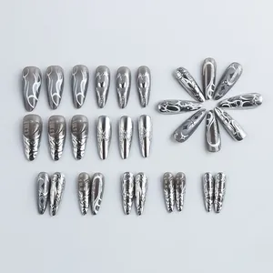 Y2K style silver metallic press-on nails with 3D heart and butterfly patterns