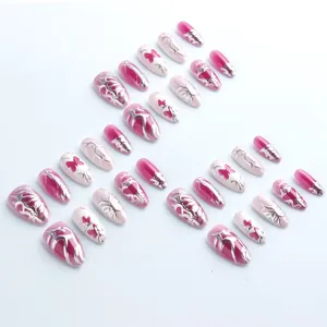 Pink cat eye almond nails with 3D silver metallic butterfly and Y2K relief art