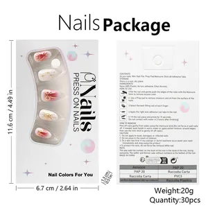 Macro detail of gradient pink press-on nails with golden heart embossing and full kit