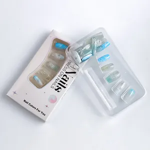 Detail view of winter snowflake press-on nails in light blue and white color packaging