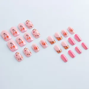 Pink press-on nail kit with floral cherry patterns and glitter finish, 24 piece set