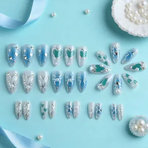 3D luxury press-on nails with blue gradient, pearls, heart accents and bow designs