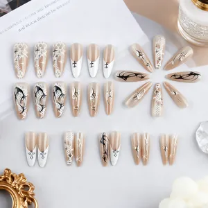 Long pointed press-on nails with silver lace cat-eye design and gothic cross patterns