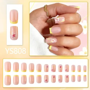 Short square press-on nails with yellow French tips and pink floral art, 24pcs set