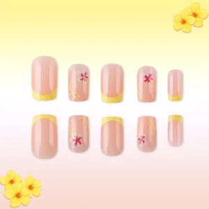 Short french press-on nails with yellow tips and red hibiscus flower patterns