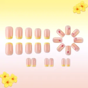 Short square press-on nails in light yellow French style with hibiscus flower patterns