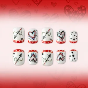 Short square Valentine's nails with red hearts, dots, and cupid's arrow designs