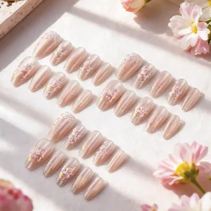 Short almond cat eye press-on nails with 3D floral relief and gold foil accents