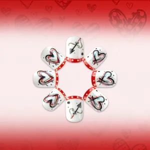 Short square press-on nails with red heart arrow graffiti and polka dot patterns