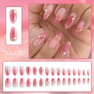 Pink gradient almond press-on nails with gold foil lines and pearl accents, 24 pieces set