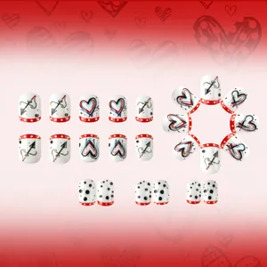 Short square press-on nails set with red hearts cupid arrows and polka dots design