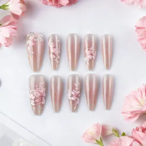 Long almond cat-eye press-on nails with 3D pink floral patterns and glitter finish