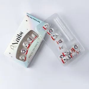 Detail of heart and arrow press-on nails in laser packaging box with transparent tray