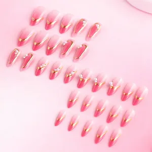 Almond pink gradient press-on nails with 90 crystals, gold foil edges and pearls