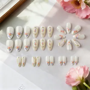 3D French floral press-on nails with almond shape, gold accents and pearl details