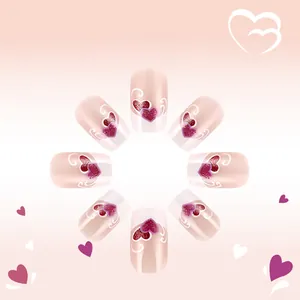 Detail of glossy French square press-on nails with purple glitter hearts and swirl patterns