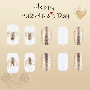 Glossy white and gold glitter heart press-on nails set for a romantic Valentine look