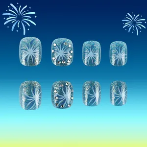 Vue détaillée de faux ongles bleus pailletés avec motifs de feux d'artifice et strass