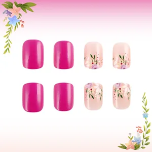 Detailed view of short rose red and floral press-on nails with a glossy finish