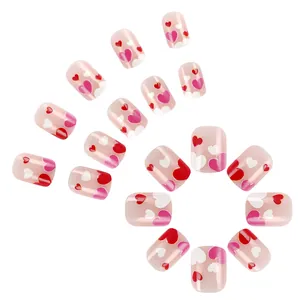 Short square glossy press-on nails in light pink with sweet red and white heart patterns