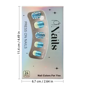 Vue détaillée des faux ongles dégradés bleus à paillettes et strass sous emballage laser
