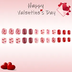 Valentine's Day press-on nails set with red hearts, glitter and XO patterns