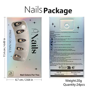 Detail view of the black and gold moon star press-on nail packaging and instructions