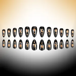 Almond-shaped black press-on nails with shiny gold star and moon patterns, 24-piece set