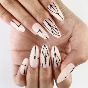 Matte almond press-on nails featuring nude base and black geometric line art patterns
