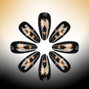 Almond shaped press-on nails in glossy black with golden star and moon designs