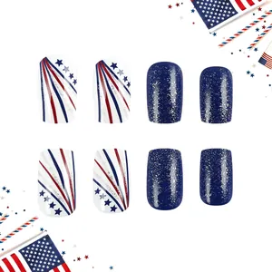 Detailed view of Independence Day press-on nails with red blue stars and silver glitter design