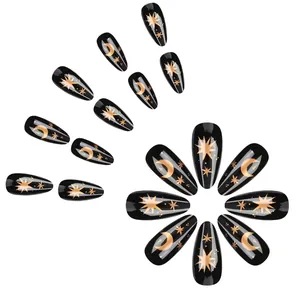 Black almond press-on nails with golden star and moon patterns, 24-piece holiday set