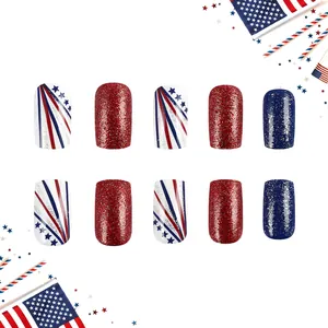 Detail of red and blue star patterned press-on nails with glitter for Independence Day