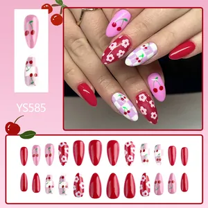 Glossy almond-shaped press-on nails with red cherry designs and checkered patterns