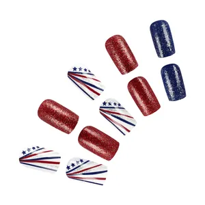 Detail of Independence Day press-on nails with red blue stars and glitter patterns