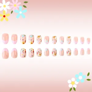 Short oval pink French press-on nails with daisy and strawberry floral designs