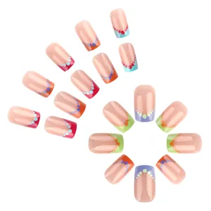 Short square press-on nails with nude base and colorful French rainbow polka dot pattern