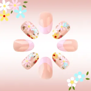Short oval pink French fake nails with glossy floral daisy and strawberry patterns